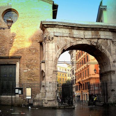 The Arch of Gallienus, the Church of Saints Vito and Modesti on the left 