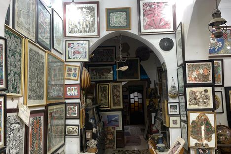 The space is crowded with original artworks kept by the artist.