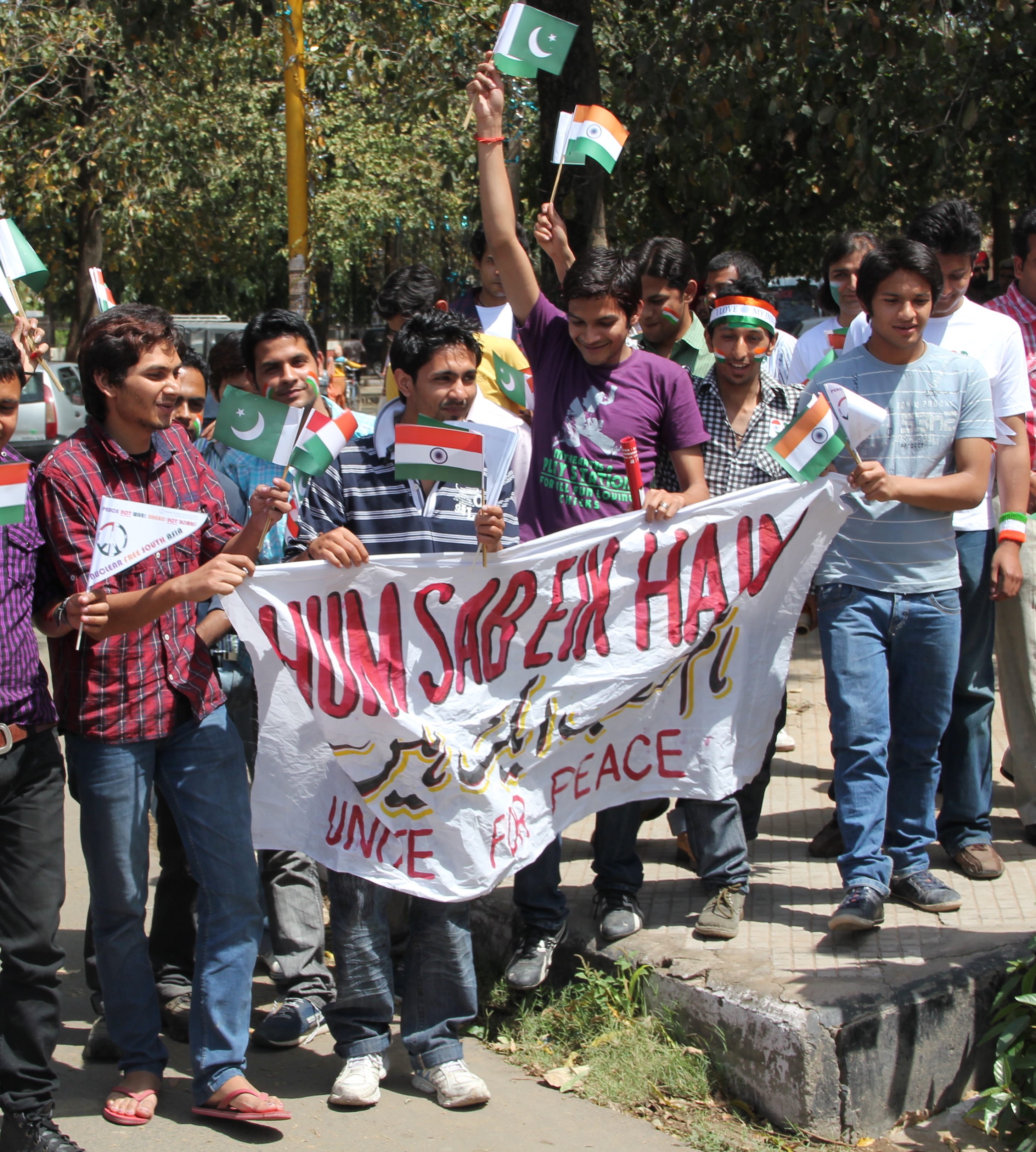 Cricket fans pose with Indian and Pakistani flags during the 2011 match.