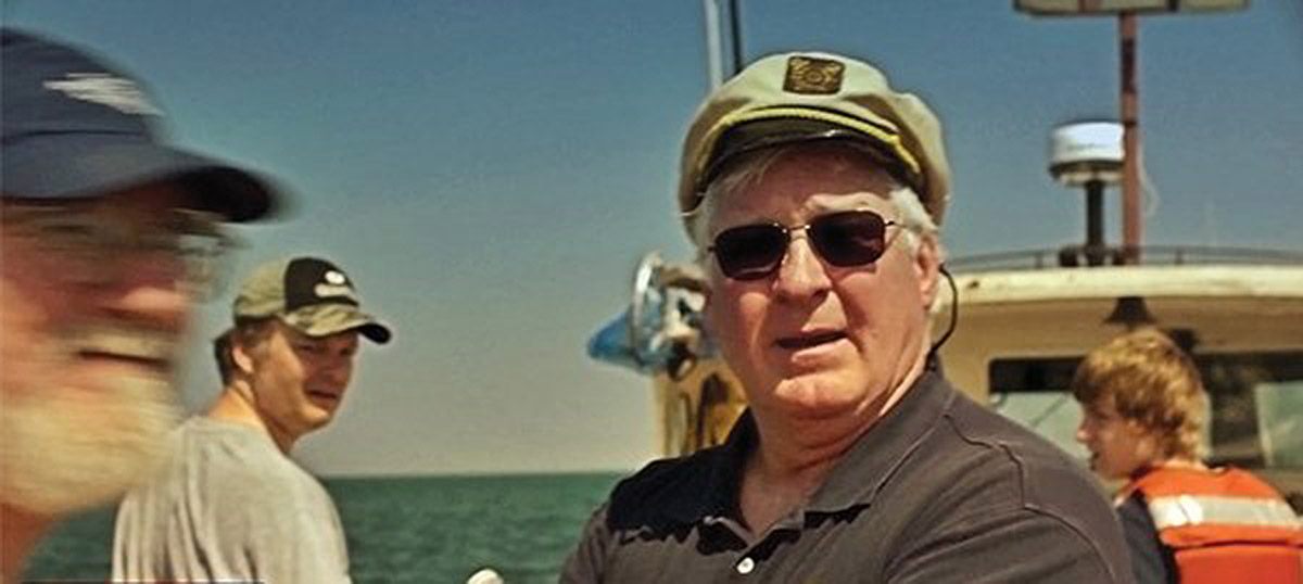 Steve Libert stands aboard a vessel during a Great Lakes Exploration Group expedition.