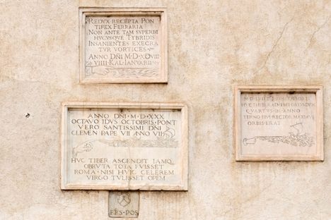 The plaques on the side of the church.