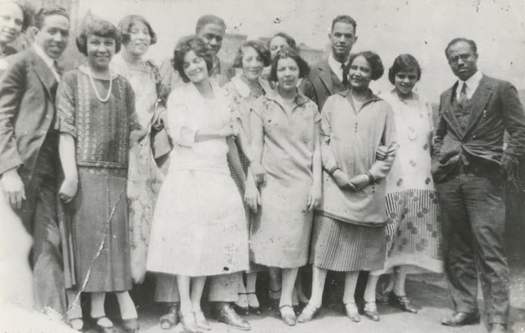 A party on the roof of Regina Anderson's home, at 580 St. Nicholas Ave. in Harlem. From left to right, attendees included Ethel Ray (Nance), Langston Hughes, Helen Lanning, Pearl Fisher, Regina Anderson (Andrews), Rudolf Fisher, Luella Tucker, Clarissa Scott (Delany), Esther Popel, Hubert Delany, Jessie Fauset, Marie Johnson and E. Franklin Frazier.