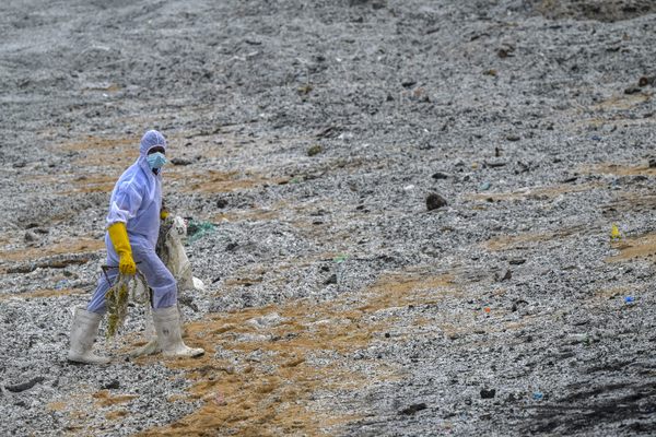 A Sri Lankan Navy soldier walks amid the debris washed ashore from the container ship MV X-Press Pearl in May 2021. 