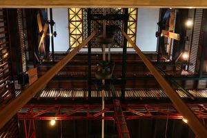 Leather belts running from the generator to the fans on the top floor.