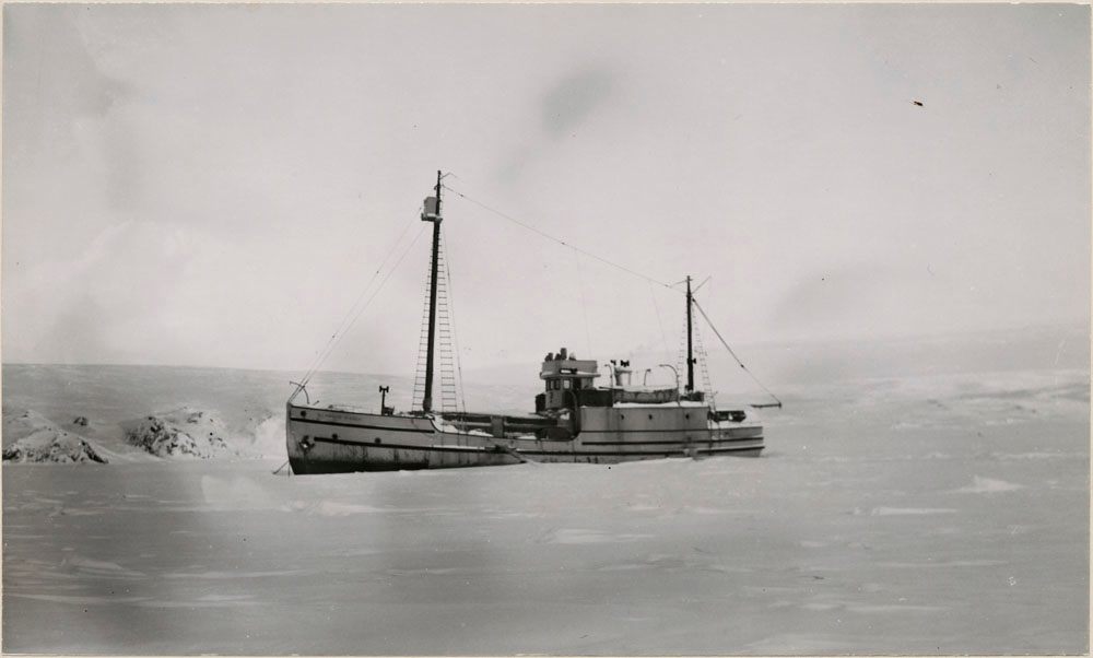 The <em>Marine St. Roch</em> locked in snow on Herschel Island in October 1947.