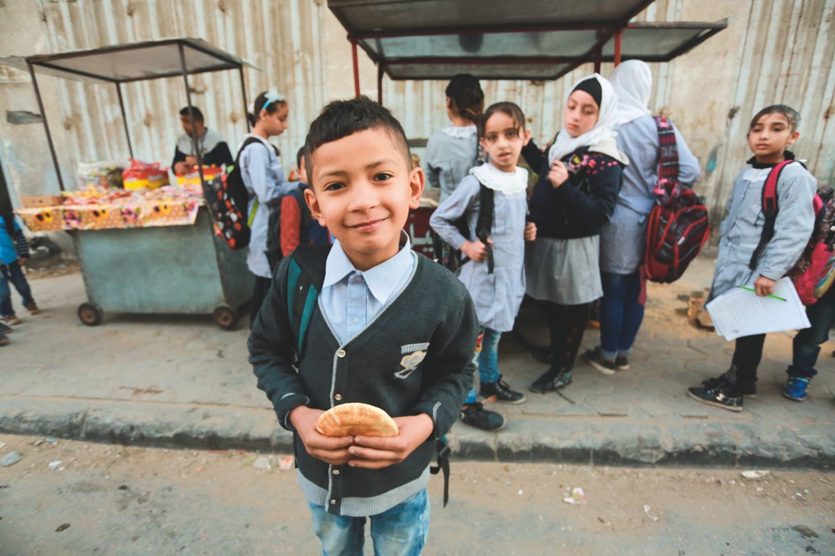 A little boy in Gaza at a falafel stand.