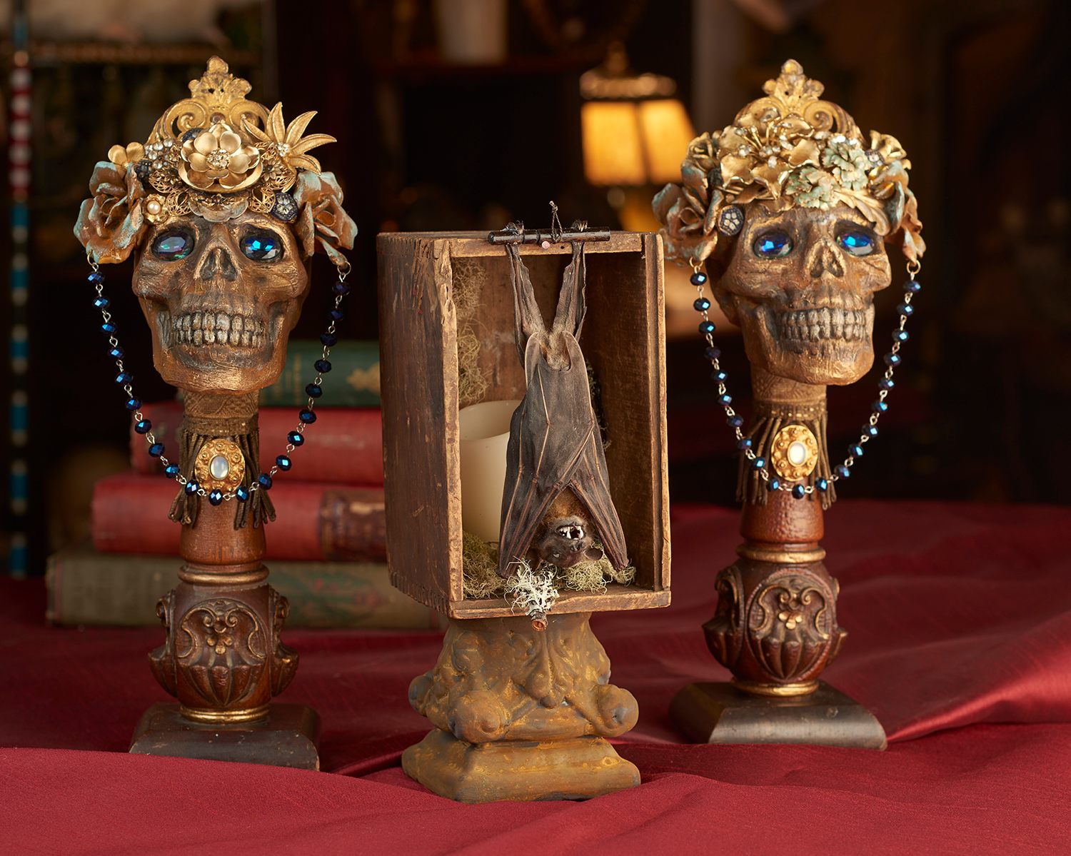 Bookends created from rosary beads and a desiccated bat.