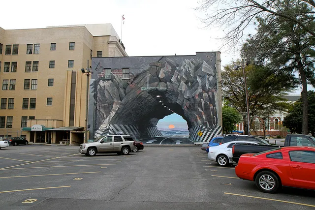 It's a mural that looks like a tunnel but is actually a mural.