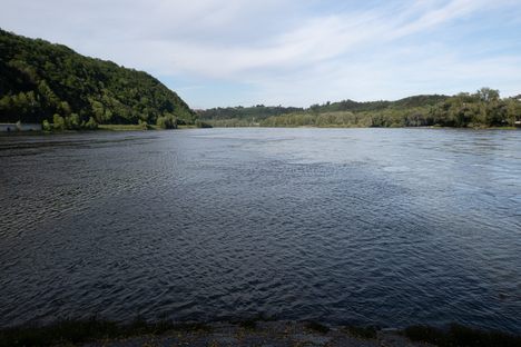 The blue Danube (right) meets the grayish-green Inn at the Dreiflüseeck in Passau.