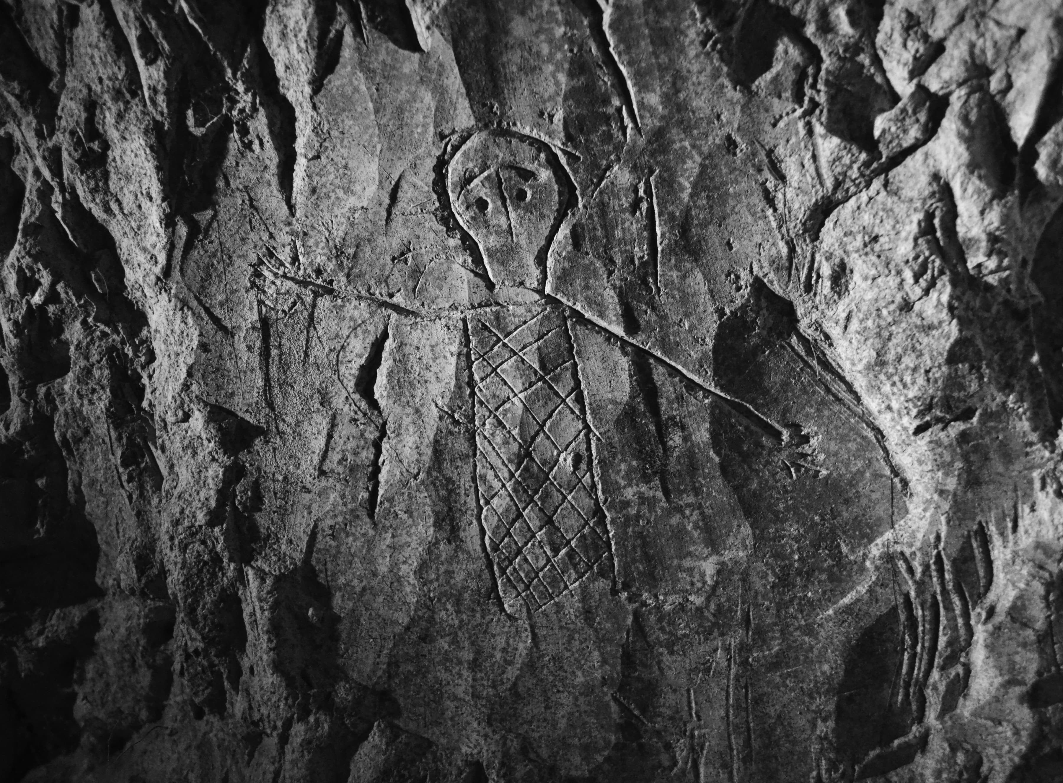A skeleton hovering over a grave in Catacomb 1, Beit Shearim, Israel.