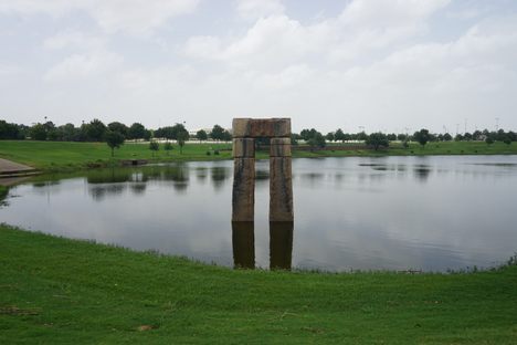 A trilithon of Caelum Moor in a pond
