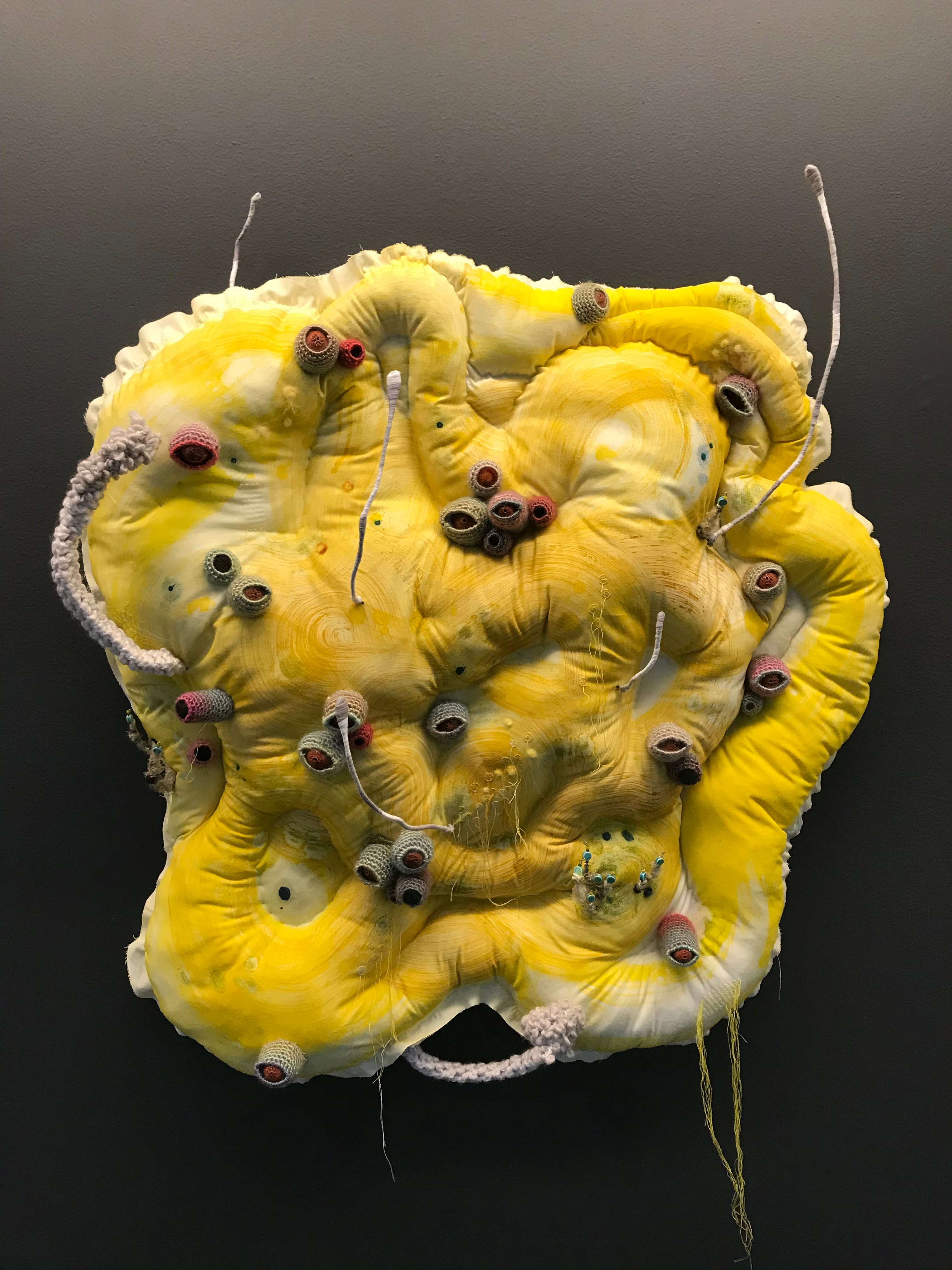 This fabric and yarn sculpture, called "Awakening" mirrors the growth of poisonous potato sprouts.