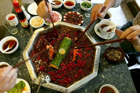 Customers eat hot pot at a restaurant in Chengdu, China. 