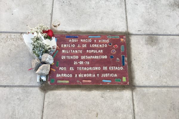 The memorial tile for Emilio de Lorenzo. 