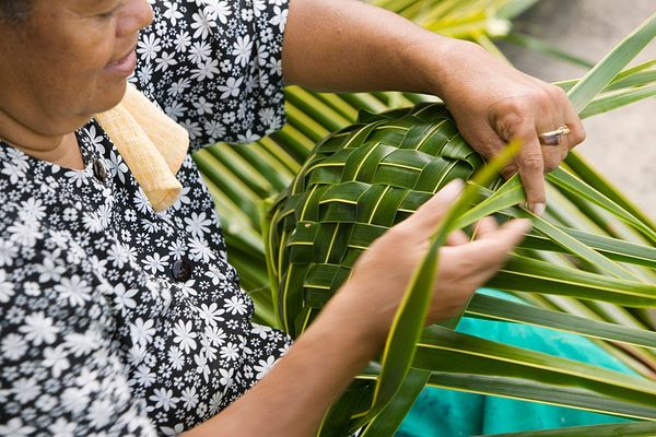 Weaving a traditional palm leaf basket