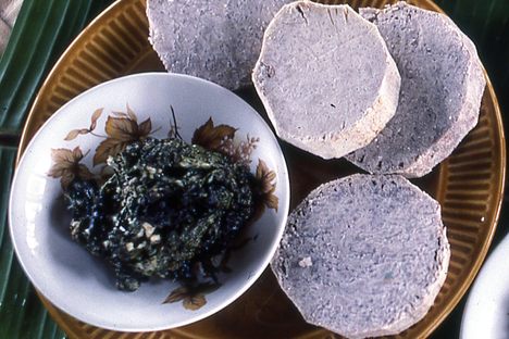 Paolo (left and lower right) with breadfruit and fish.