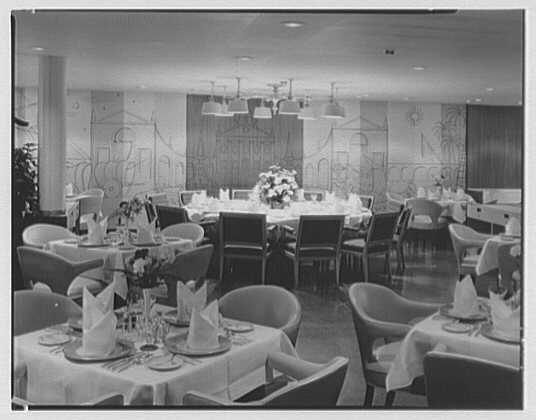 Folded napkins on display in a dining room, 1958. 