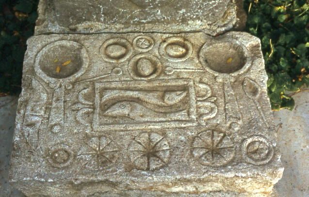 The base of one Timgad stela depicts a symmetrical spread of foods.