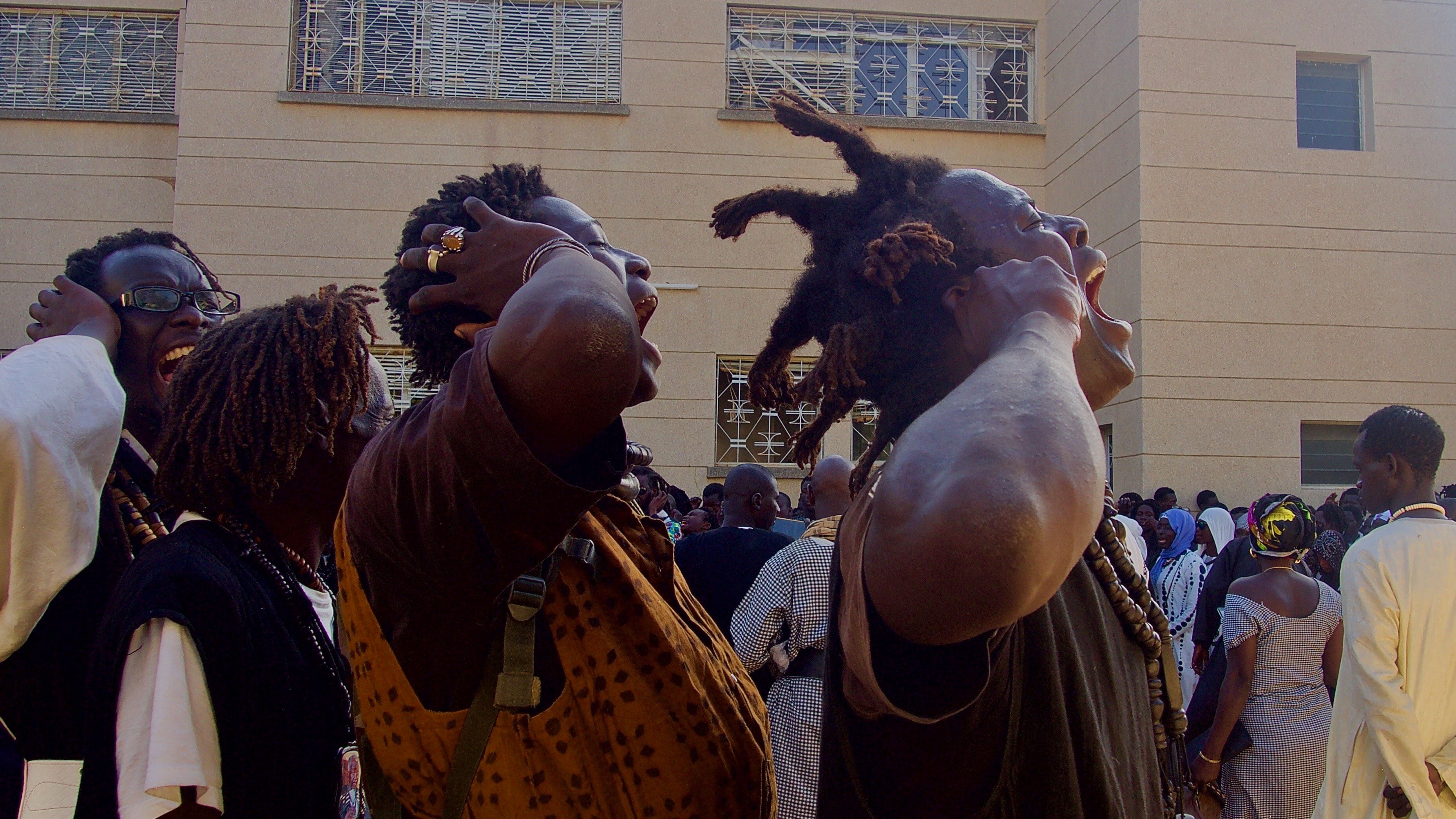 The Baye Fall sing a call and response refrain at the Grand Mosque.