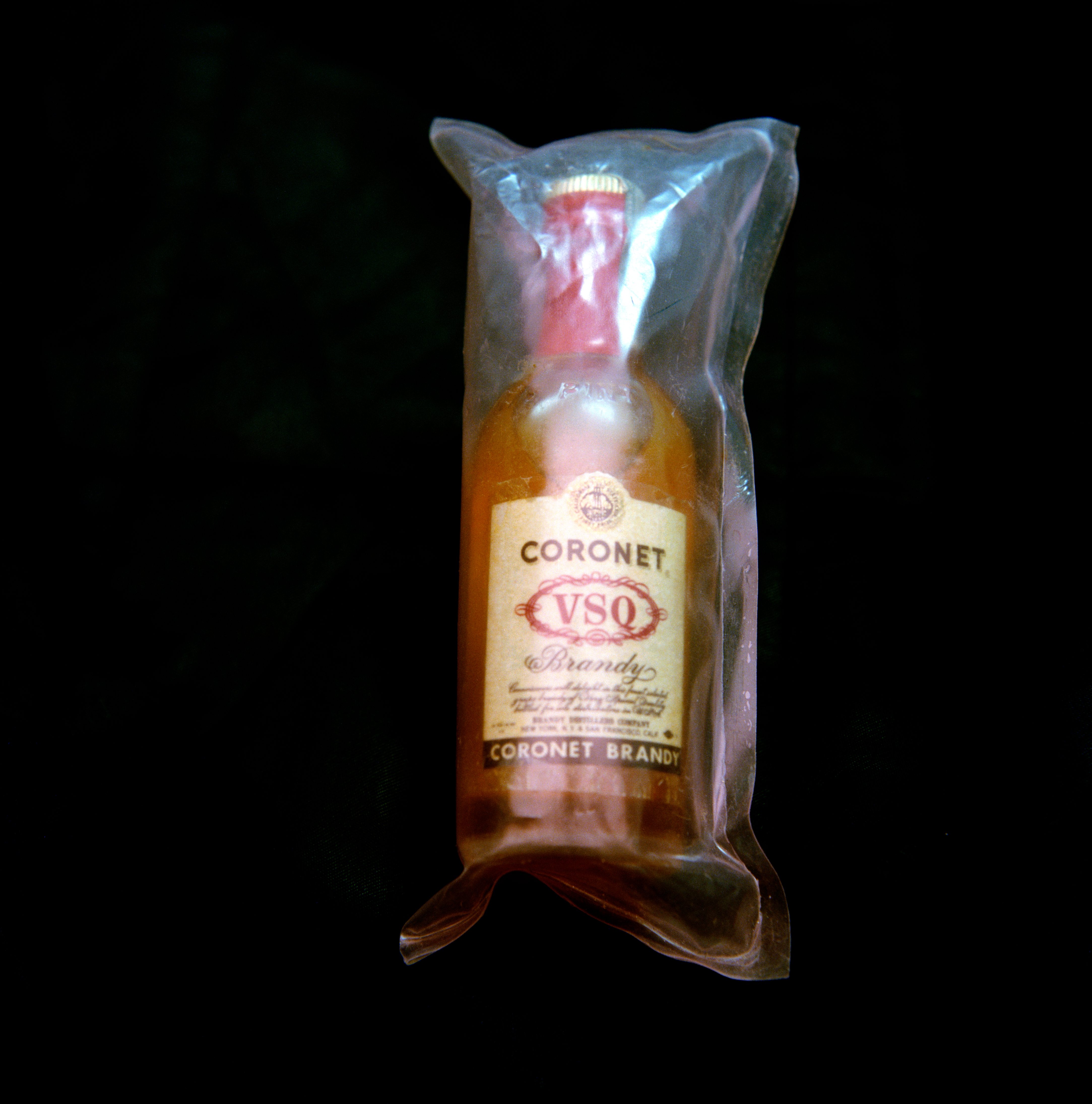 An unopened miniature bottle of Coronet Brandy from the personal collection of astronaut James Lovell, who took it on board <em>Apollo 8</em>, a surprise Christmas gift from Director of Flight Crew Operations Donald Slayton. 