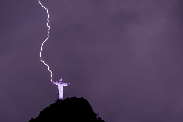 Lightning strikes the hand of the Christ the Redeemer statue that stands on a mountaintop above Rio de Janeiro.