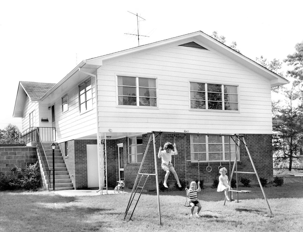 After the war, some of the prefabricated houses—like this "A" version, photographed in 1957—were transformed with brick and siding.