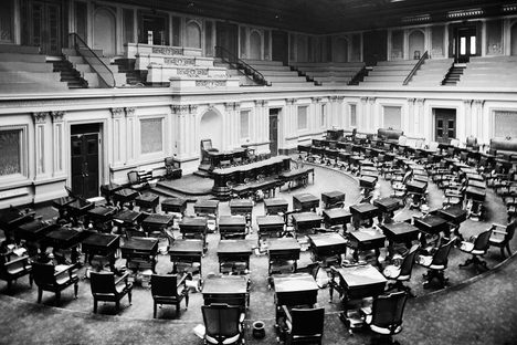 An empty senate chamber, circa 1873. 