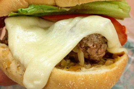 Gooey, melted cheese is characteristic of the steamed cheeseburger.