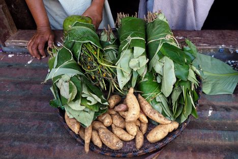 Yams and foraged greens for sale at Mujai’s cafe.