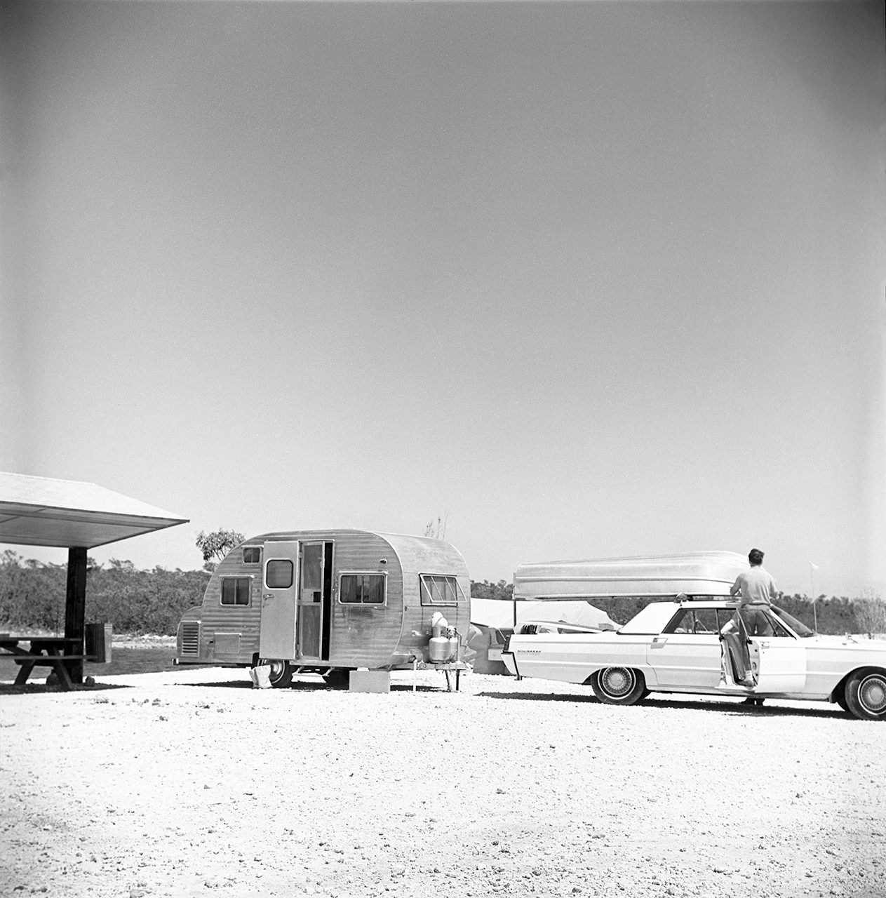 The teardrop trailer—affectionately called a “canned ham”—was a popular option for families after World War II, beloved for its simplicity, affordability, and easy towability. Above, a teardrop trailer sits hitched at a campsite in the Florida Keys, circa 1969.