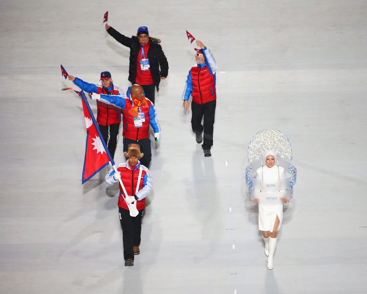 Dachhiri Sherpa carries his country's flag during the Sochi 2014 Winter Olympics Opening Ceremony. 