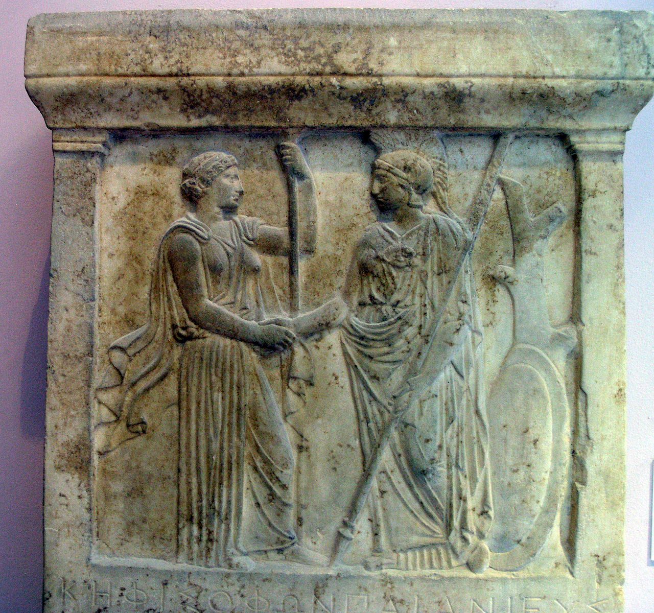 Hera and Athena, shaking hands.