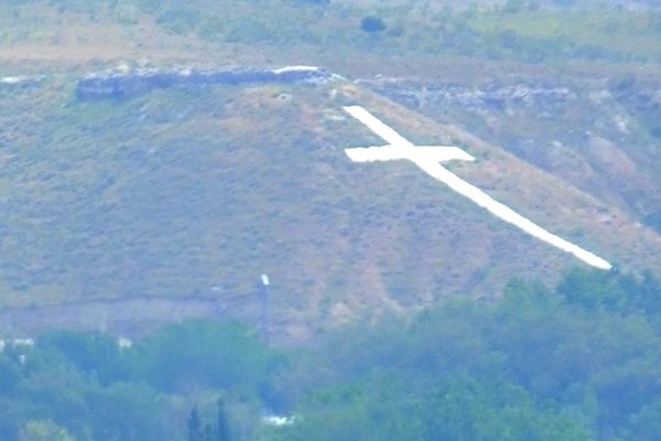 The huge white cross by the Madrid Airport is the Paracuellos Cementerio de los Martires.