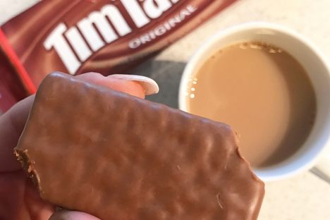 Step one: Bite off opposite corners of the biscuit.