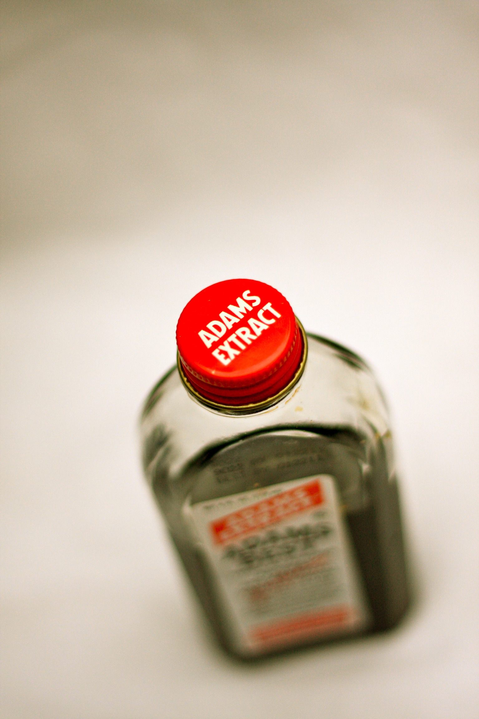 A bottle of Adams vanilla extract, shot from above.