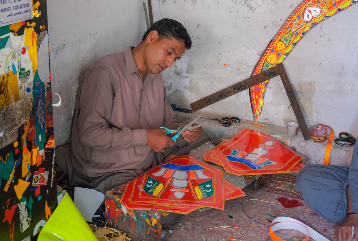 Each region of the country has its own style. Here, Imran Riaz, a truck artist from Rawalpindi, creates chamak patti or sticker art.