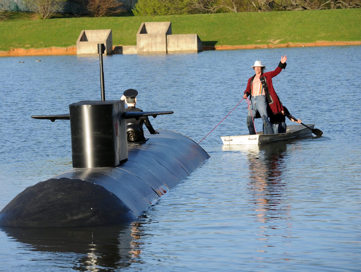 Standing in a boat, Mark Cline wishes everyone a happy "April Fool's Day Eve" on Saturday, March 31, 2012.
