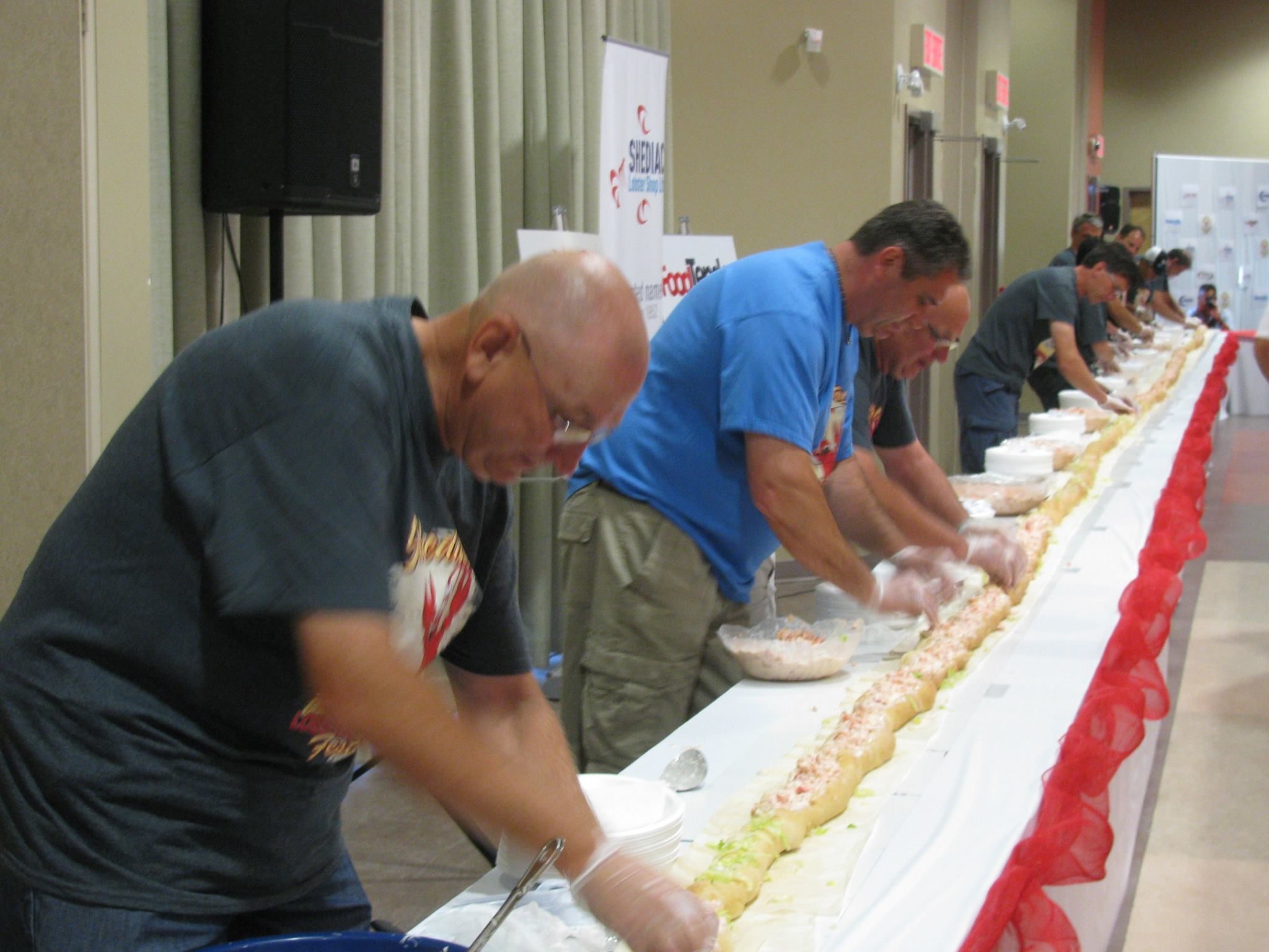 Volunteers construct Shediac's first ever Longest Lobster Roll, in July 2014.