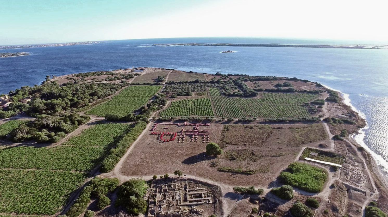 Finucci's plastic ruins on the island of Mozia, with actual ancient ruins at bottom. 