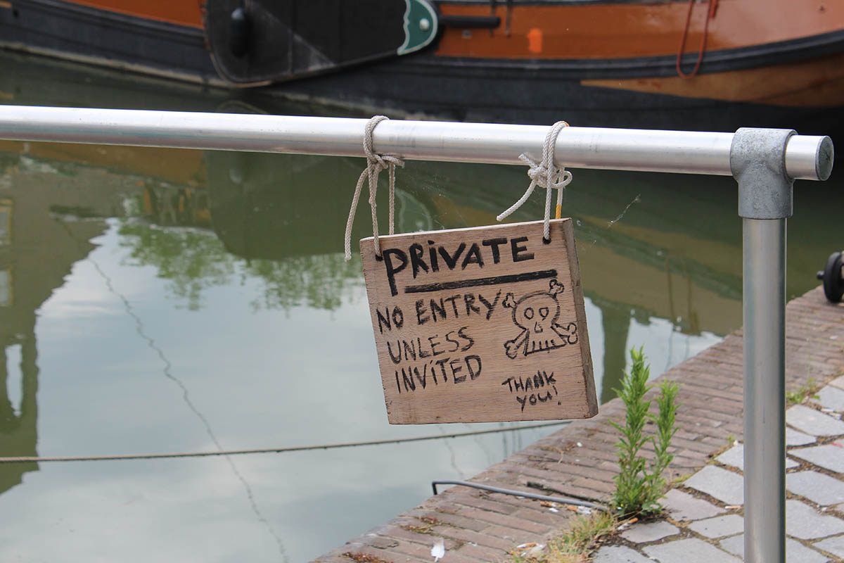 A no-entry sign by one of the boats.