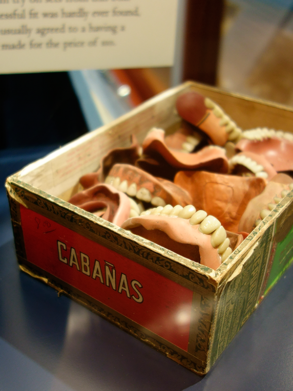 Displays at the Weaver Dental Museum include a jumble of dentures.