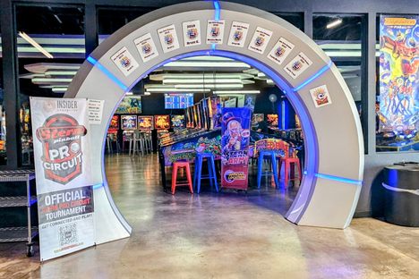 The entrance to the pinball section of the arcade is marked an archway of pinball honorees.