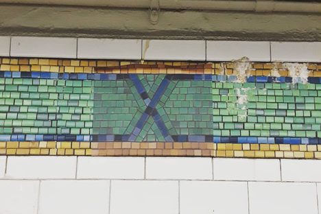 One of the tile sticker designs slowly peeling off the wall.