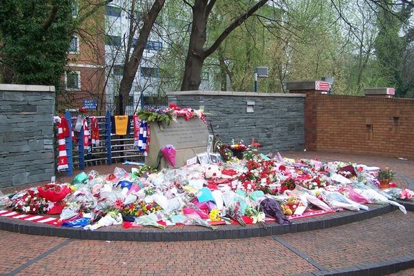 Tributes on the memorial next to the stadium.