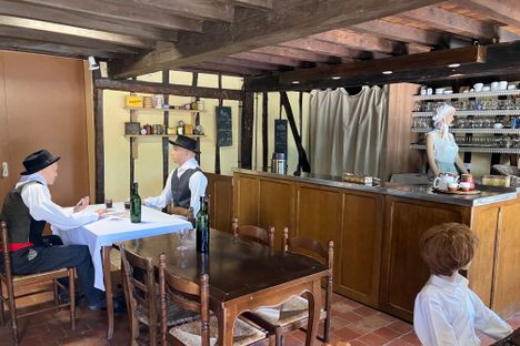 A village bar-restaurant complete with mannequins. 