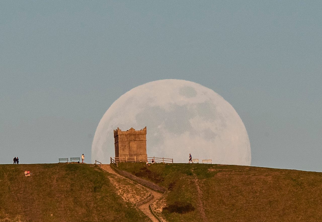 The Flower Moon—the first full moon in May—rises over Lancashire, England, in 2020.