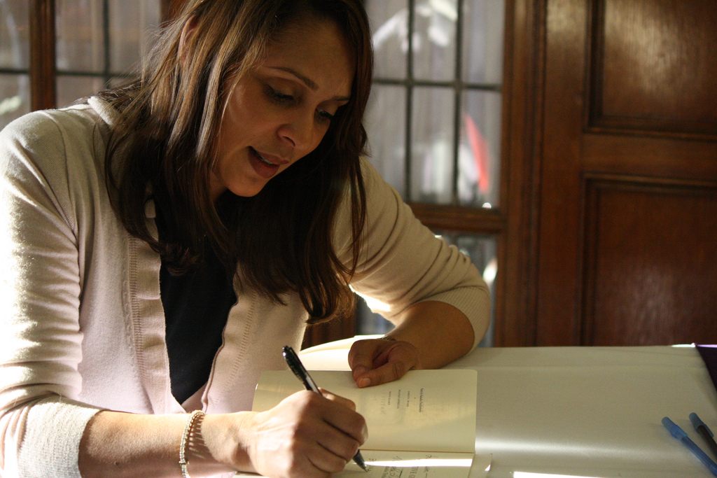 Natasha Trethewey—a Pulitzer Prize winner, two-time U.S. Poet Laureate, and canonical Poet Voice reader—signs a book at the University of Michigan.