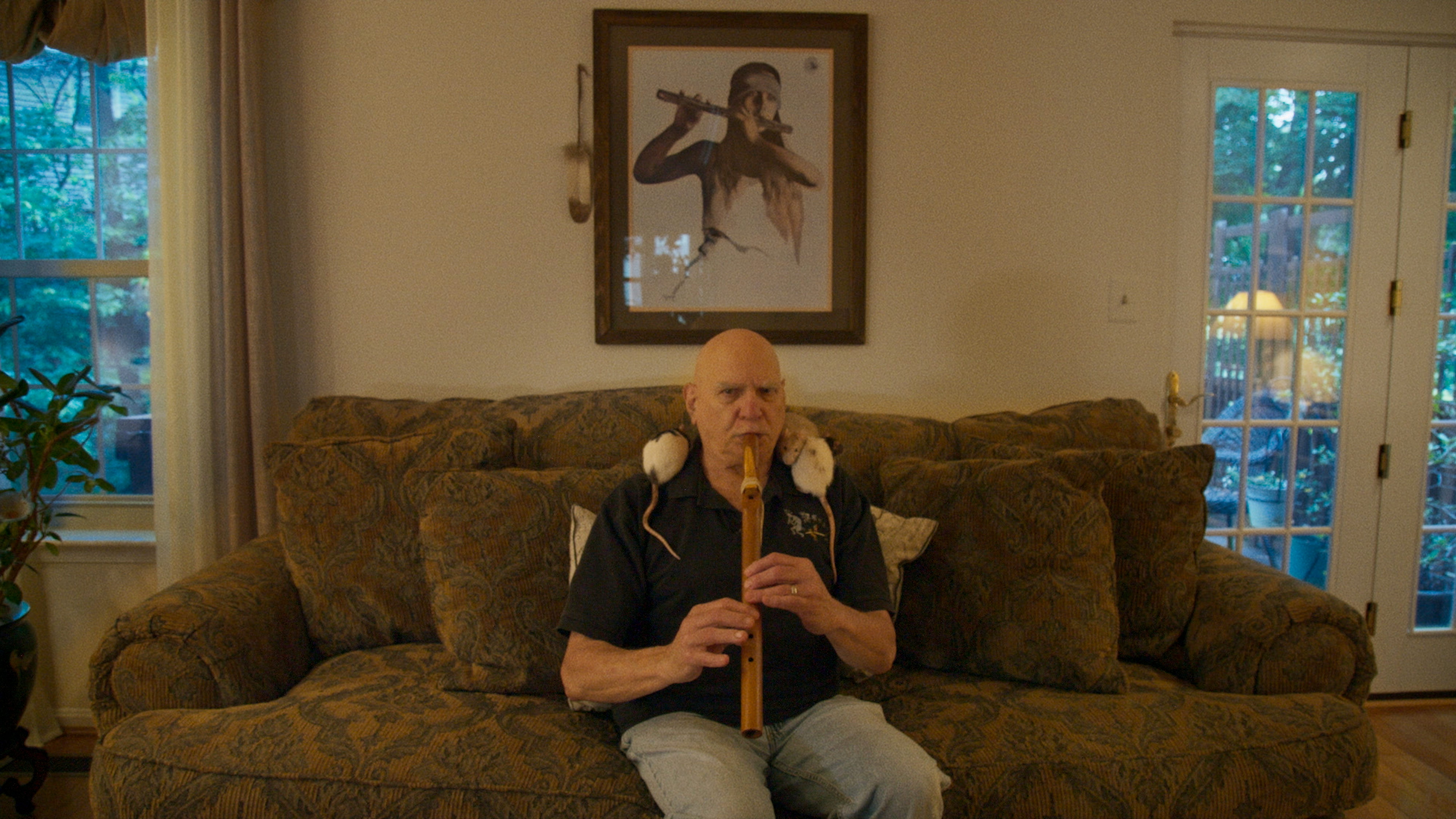 Louis Eagle Feather plays music with his rats.
