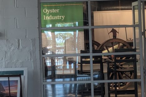 Oyster Wars Cannon visible through the window as part of the Oyster Industry display.