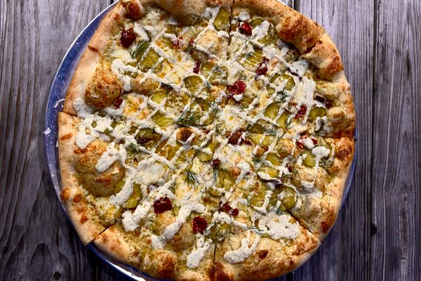 A “Hot Matty” pizza topped with pickles, house-made ranch, Calabrian chiles, dill, and so much cheese.